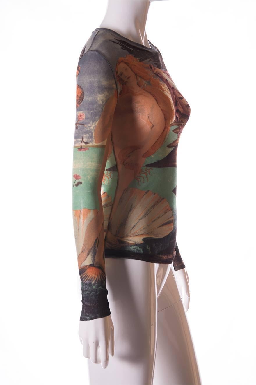 Sheer and stretchy top by Jean Paul Gaultier featuring a print with Boticelli's 'Birth of Venus'.  Raw edged hem on the sleeves and at the bottom of the top.  This is a stunning and rare piece, perfect for art lovers.  Circa
