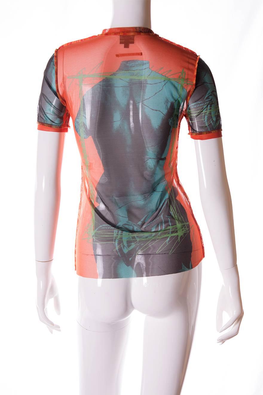 Sheer, short sleeved tshirt by Jean Paul Gaultier in a print featuring a statue bust on the front and the back.  Deconstructed style with exposed stitching and raw hems at the bottom of the shirt and sleeves.  Vibrant orange offset by lime green and