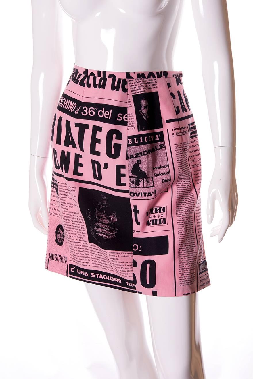 This piece is a classic Moschino, which showcases the label's irreverent sense of humour.  High waisted skirt in bubblegum pink with newspaper clippings in Italian all over.  Circa 1983.

Marked size – 44
To fit – S-M

Waist – 36 cm
Length –