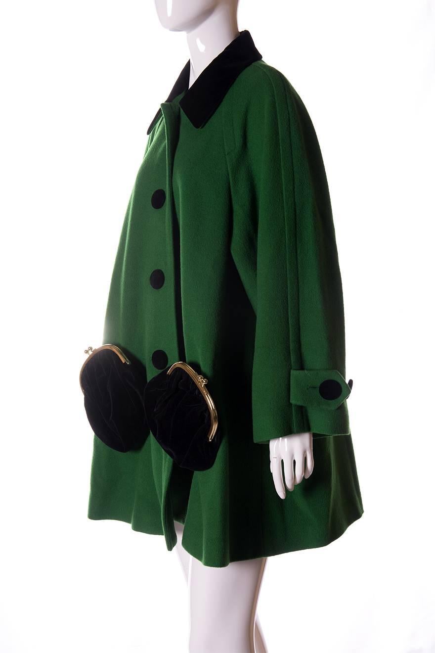 Vintage coat by Moschino Cheap and Chic in emerald green.  Oversized velvet coated buttons and 2 huge coin purses as pockets at the front of the coat.  A-line fit.  Circa late 80s.

Marked size – No marked size
To fit -  Medium

Chest – 56.5