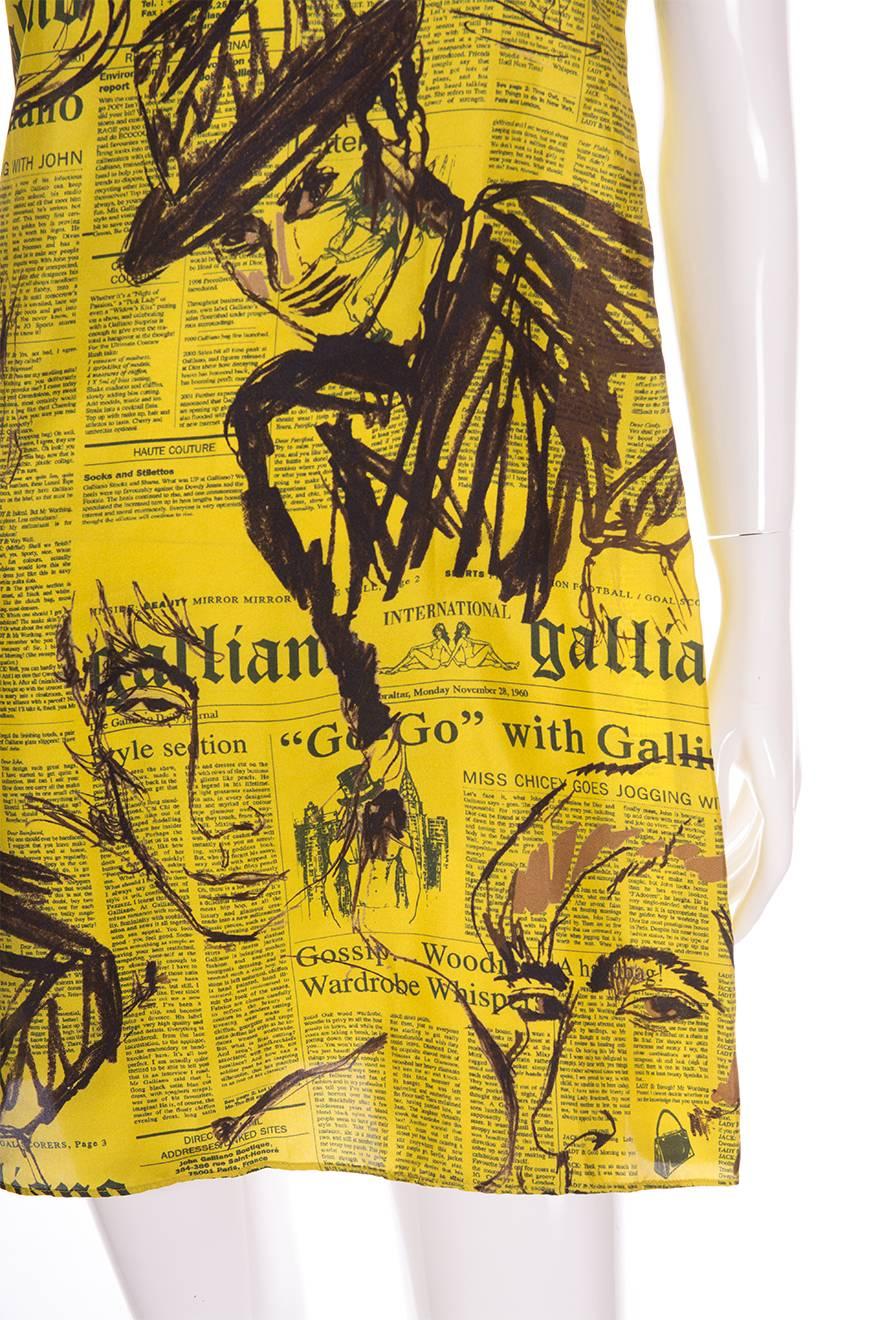 Mini satin slip dress by John Galliano in his iconic newspaper print.  This version is in a bold shade of citrine and has sketches all over the print.

Marked size: 28/42 (IT)
To fit: S

Chest: 46.5 cm
Length: 86 cm

This piece is in