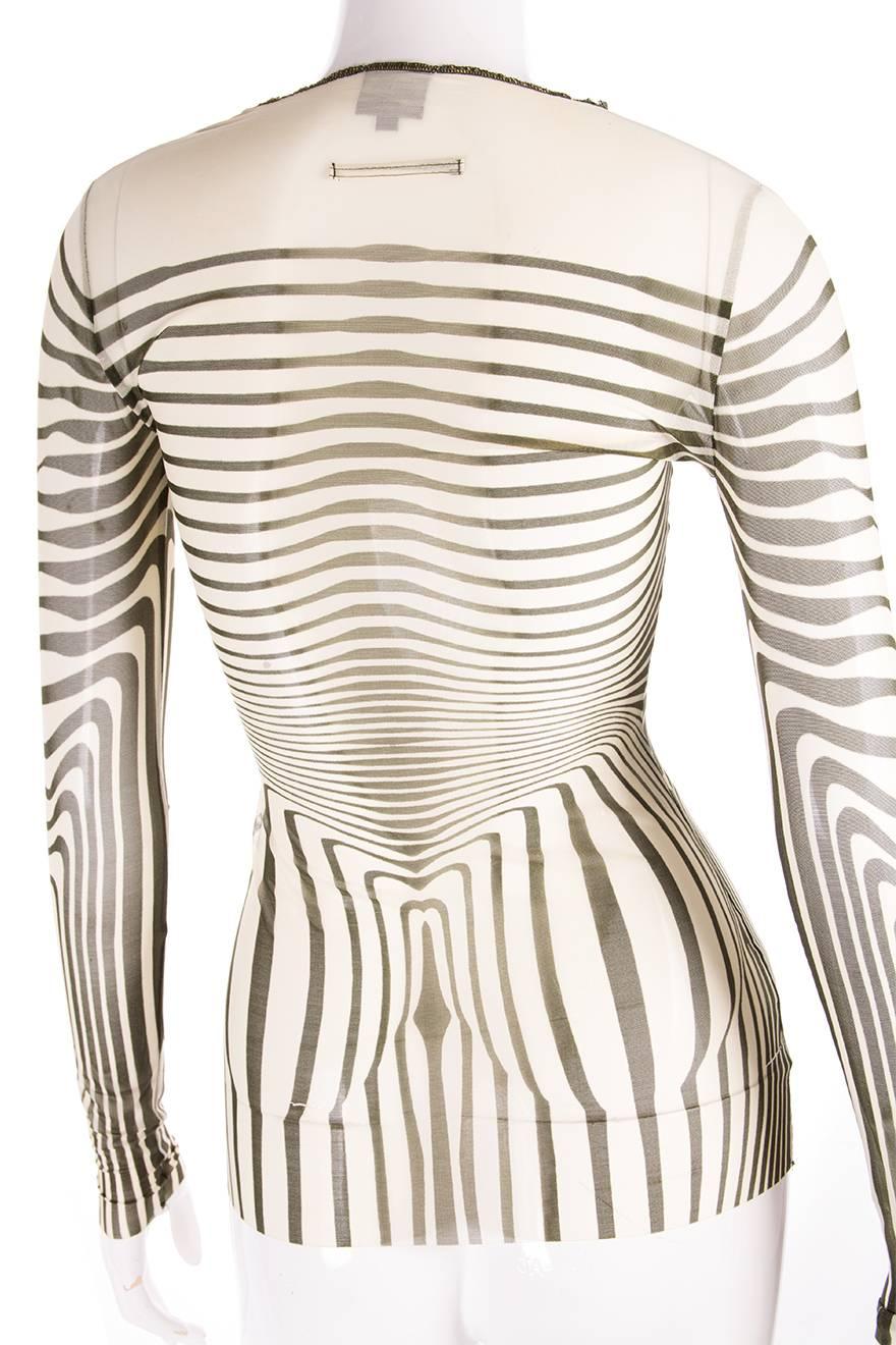 Sheer stretch top by Jean Paul Gaultier in an iconic design.  Circa 1996.

Marked size: 40 (IT)
To fit: S

Chest: 36 cm (unstretched)
Length: 64 cm

Excellent condition demonstrating little to no visible signs of wear
