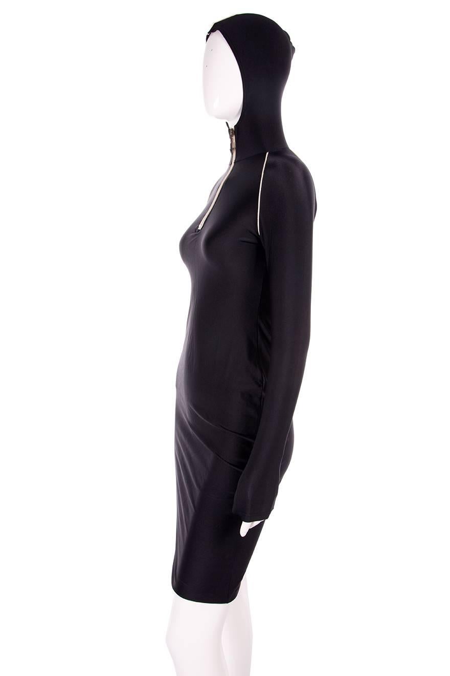 Ultra cool hooded dress by Jean Paul Gaultier.  Body hugging fit.  Circa 90s.

Marked size: 40 (IT)
To fit: S

Chest: 35 cm (unstretched)
Waist: 31 cm (unstretched)
Length: 98 cm

Excellent condition demonstrating little to no visible signs of wear.