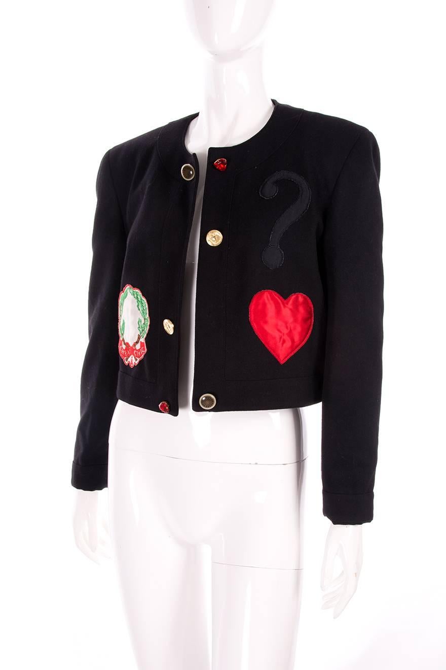 Jacket by Moschino Cheap and Chic with an applique love heart and question mark.  Circa 90s.

Marked size: 44 (IT)
To fit: M

Chest: 52 cm 
Length: 47 cm 

Please note there is no closure on this jacket

Excellent condition demonstrating little to