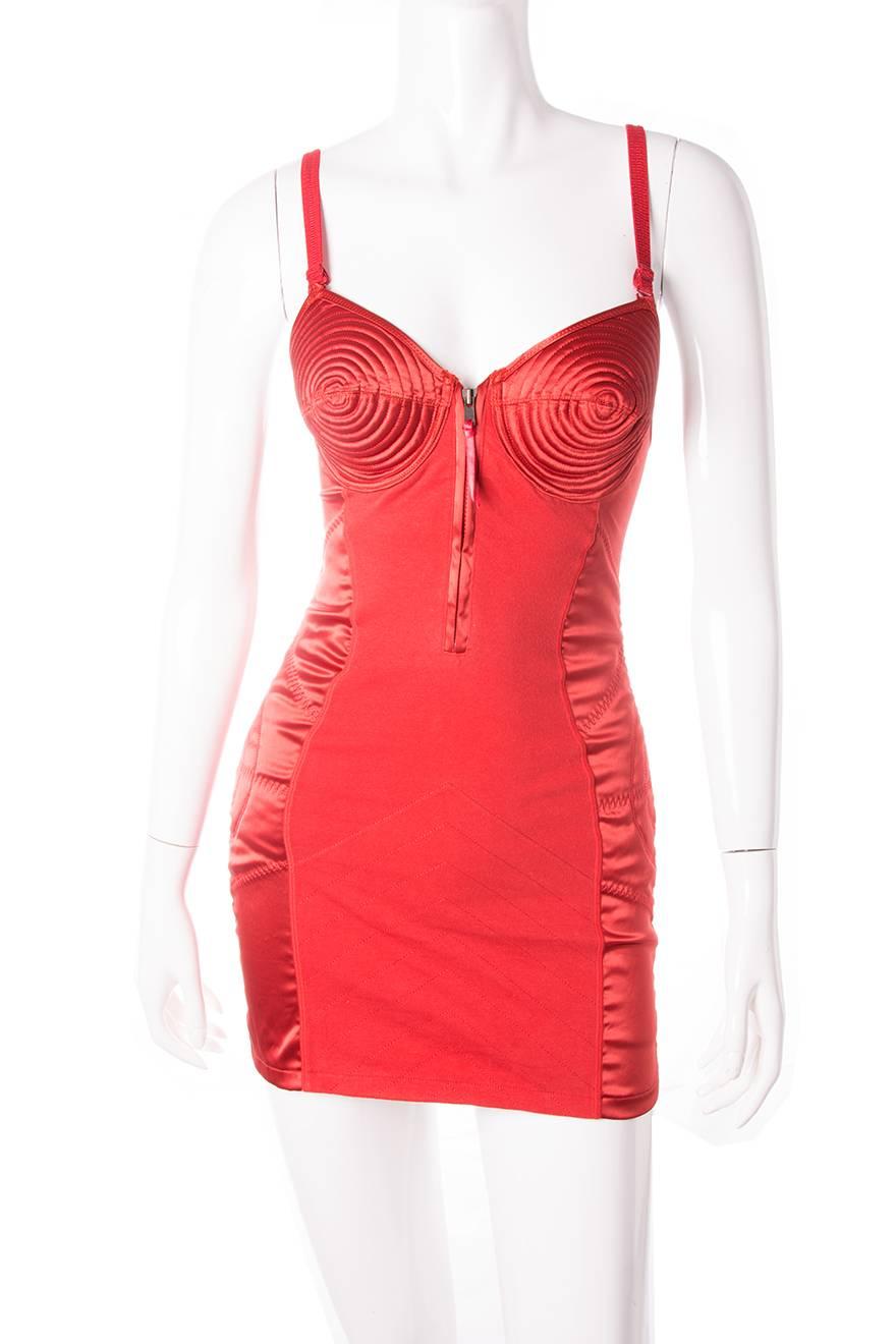 A rare piece of fashion history.  This lingerie inspired zip-up dress is an iconic Jean Paul Gaultier design.  The dress is scandalously short in length and comes with a matching skirt so it can also be worn as a top.  Adjustable straps. 
 Circa