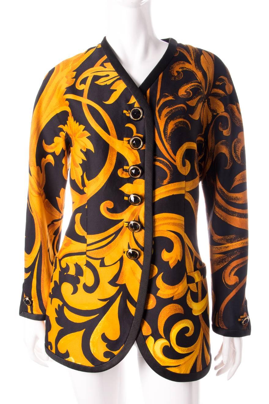 An iconic and instantly recognisable Gianni Versace piece. Single breasted jacket featuring a baroque all over print in gold and black. Circa early 90s.
 
Excellent condition demonstrating little to no signs of visible wear. This jacket appears