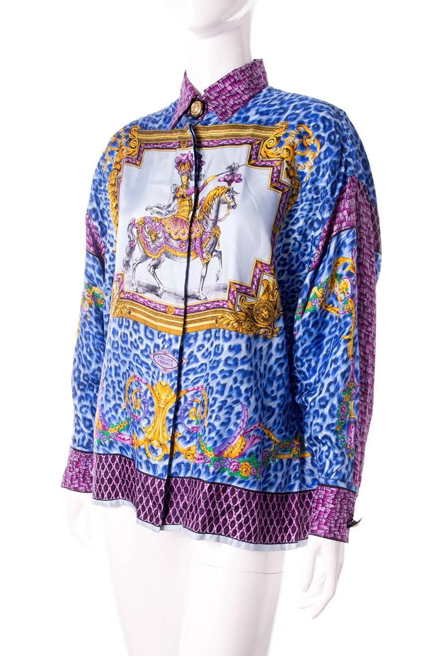 Silk shirt by Gianni Versace in an incredible rococo themed print. Blue leopard print. Gold medusa head buttons. Circa 90s.   

Excellent condition demonstrating little to no signs of visible wear


Marked size: No marked size
To fit: S
Chest: 52