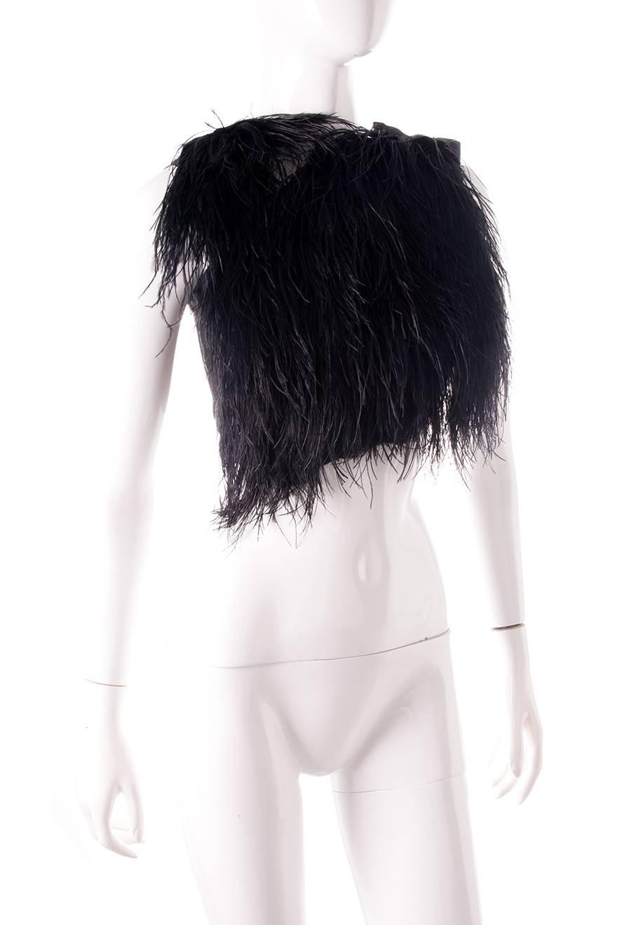 Ostrich feather top by Gucci, lined in silk. Snap fastening closure on the shoulder. Circa 2010.
 
Excellent condition demonstrating little to no signs of visible wear

Marked size: 38 (IT)
To fit: XS

Chest: 41 cm
Length: 31 cm
Waist: 36 cm