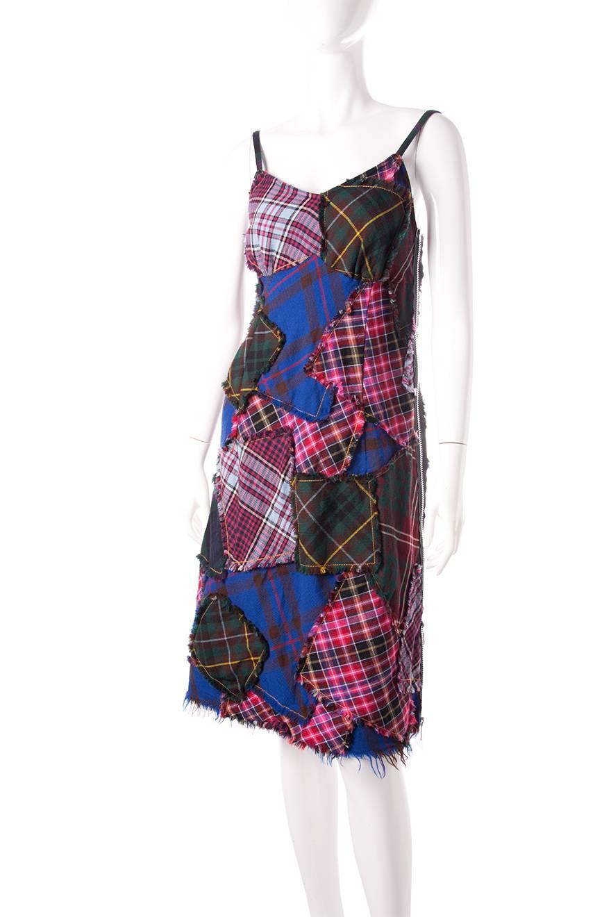 Plaid patchwork dress by Comme Des Garcons Tricot. AD2004. This dress has working zippers on both sides that can unzip the whole way.   
Excellent condition demonstrating little to no visible signs of wear.

 Marked size: M
To fit: S-M

Chest: 43