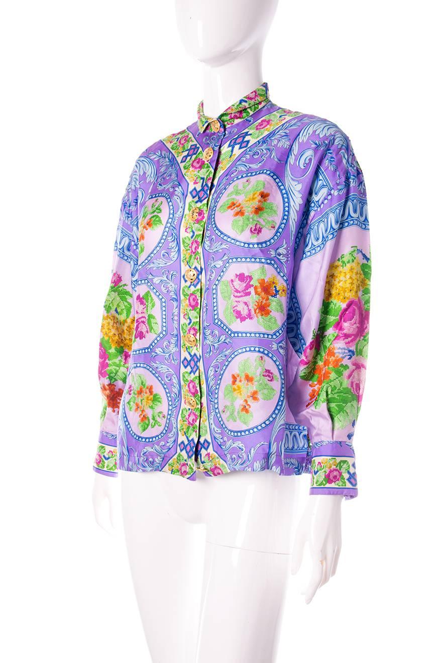 Silk floral shirt by Gianni Versace.  Medusa head buttons.  Lace cutwork panel at the back.  Circa 90s.

Very good condition showing a few minor signs of wear.  Some minor discoloration on the inside of the collar and a few small marks