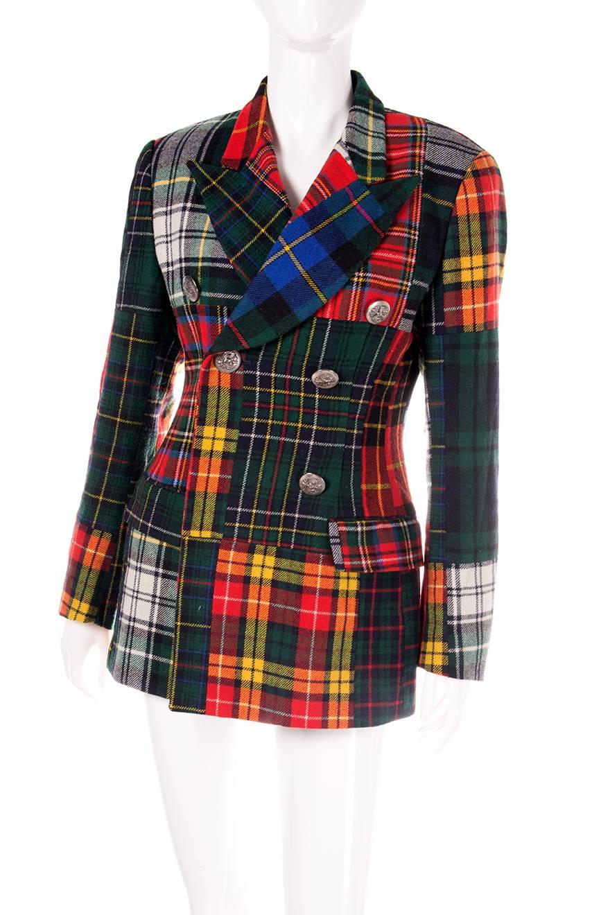 Incredible and rare double breasted jacket by Dolce and Gabbana in patchwork tartan fabric. Circa 90s.

Excellent condition demonstrating little to no visible signs of wear

Marked size: 42 (IT)
To fit: S
Chest: 44 cm
Waist: 38 cm
Length: 74 cm