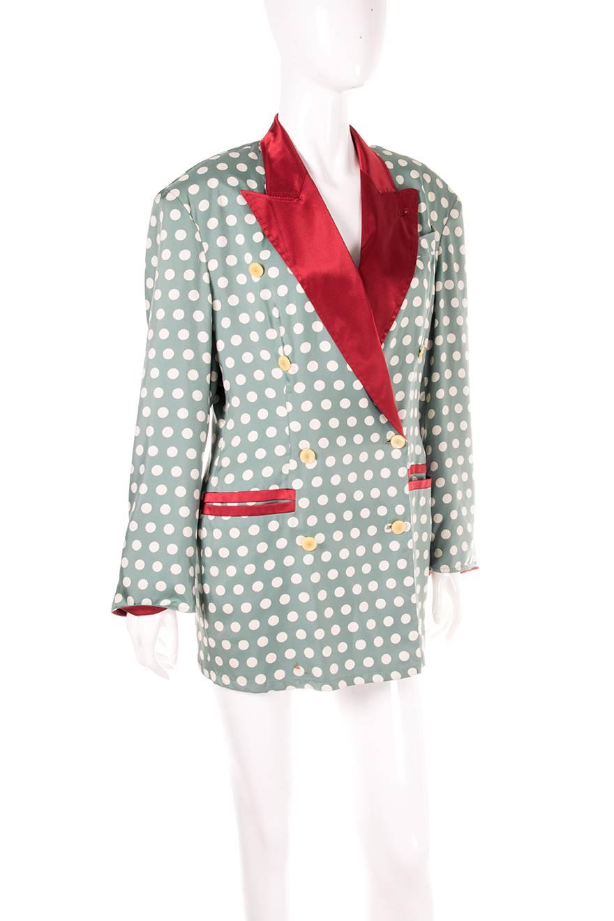 Double breasted polka dot jacket by Jean Paul Gaultier in teal. Constrasting red lapels. Circa 90s.

Excellent condition demonstrating little to no visible signs of wear.

Marked size: 40 (IT)
To fit: S-M (runs large/oversize fit)
Chest: 52