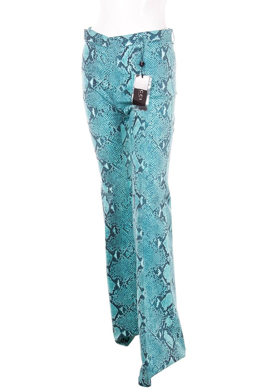 Bootcut, mid waisted pants by Tom Ford for Gucci in a shocking blue python print. Circa 90s.

Excellent condition demonstrating little to no visible signs of wear.  Original tags still attached.  

Marked size: 40 (IT)
To fit: S
Waist: 38 cm
Hips: