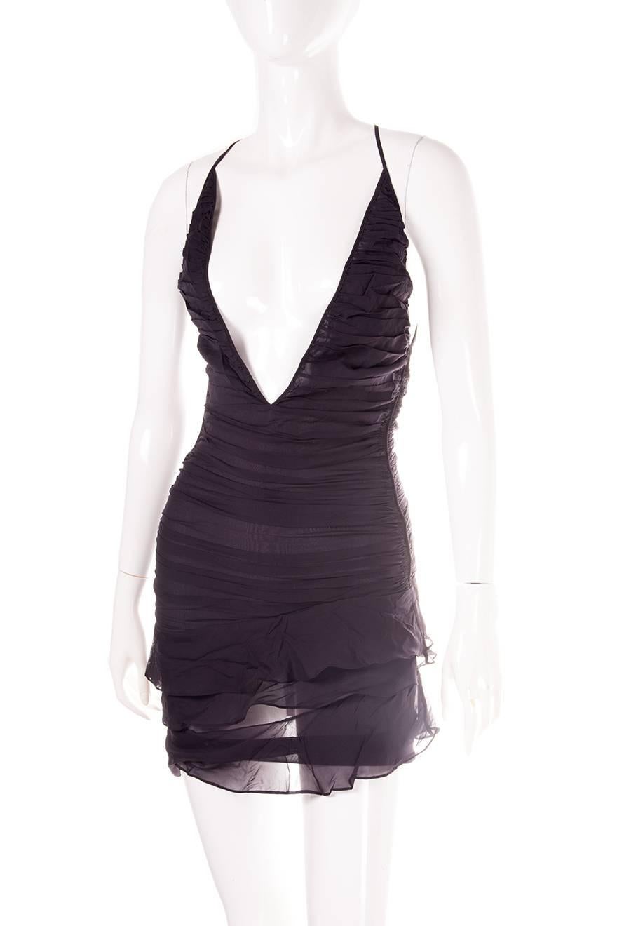 Semi sheer plunging dress by Gucci. Criss cross back. Circa 00s.

Excellent condition demonstrating little to no visible signs of wear

Marked size: 38 (IT)
To fit: XS
Chest: 38 cm
Waist: 30 cm
Length: 88 cm