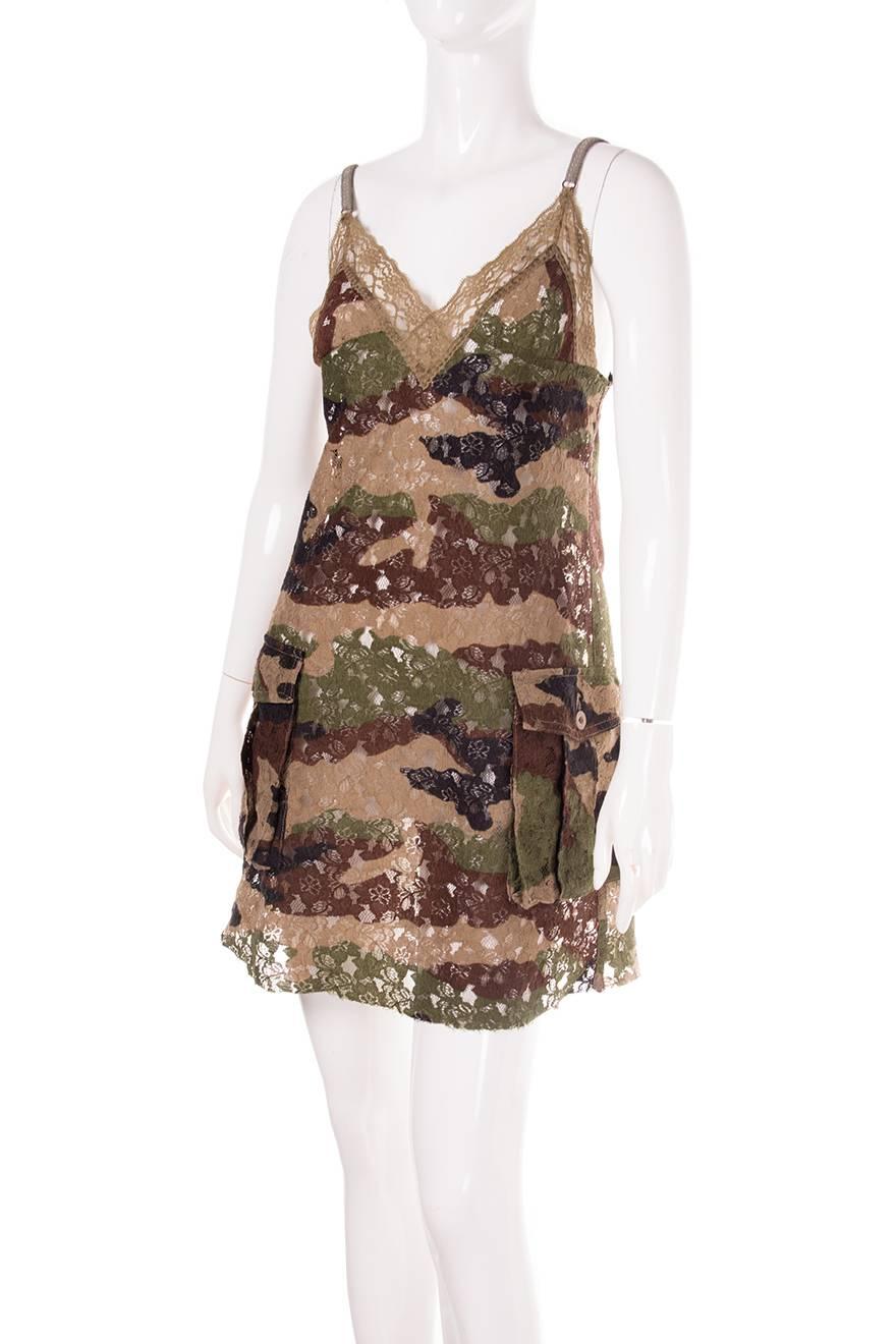 Lace slip dress by Junya Watanabe Comme Des Garcons Man with a camo/army print. Two large pockets at the front. Lace trim along the neckline. Circa 00s.

Excellent condition demonstrating little to no visible signs of wear

Marked size: M
To fit: