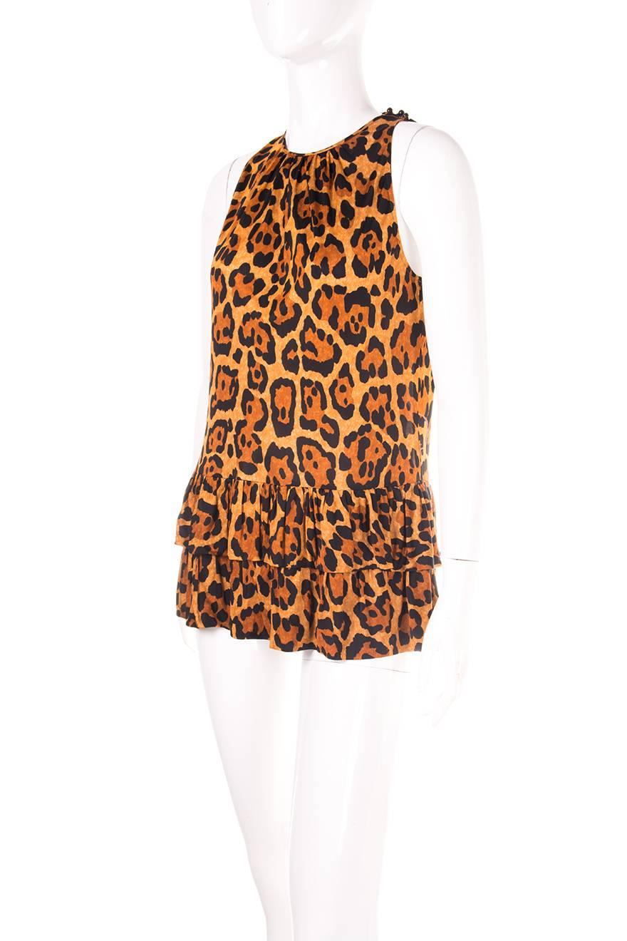 Ruffled tunic top in animal print by Christian Dior. John Galliano era, circa early 00s.  

Excellent condition demonstrating little to no visible signs of wear. Original tags still attached

Marked size: 40 (FR)
To fit: S (runs small)
Chest: 45