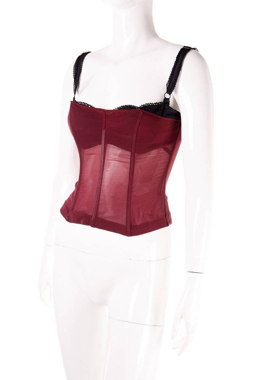 Wine coloured sheer bustier by Dolce and Gabbana.  Boned body.  Adjustable straps.  Circa 90s.

Very good condition demonstrating some minor signs of wear.

 

Marked size: 40 (IT)

To fit: S

 

Chest: 38 cm

Waist: 31 cm

Length: 47 cm

Please