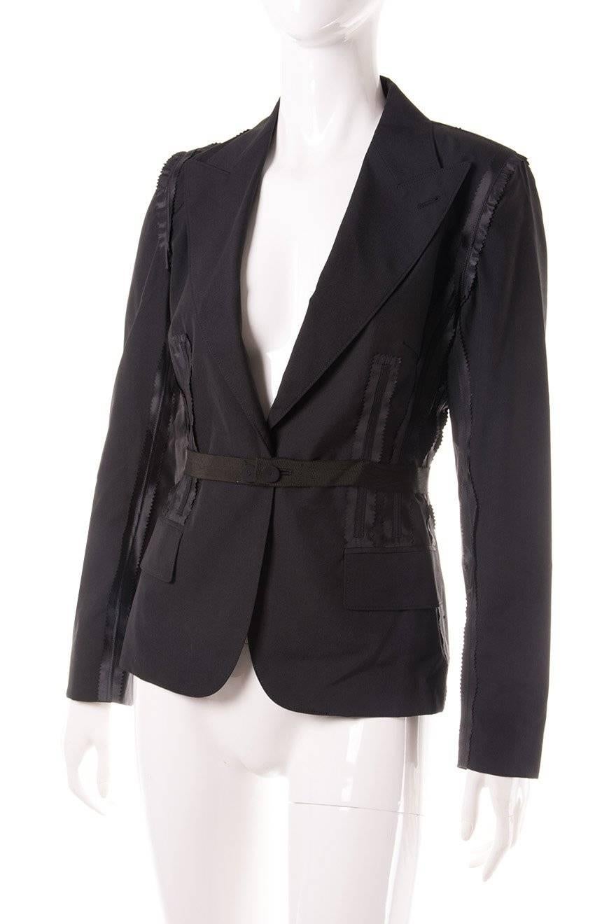 

Classic black jacket with a twist by Jean Paul Gaultier.  Deconstructed detail.  Circa 90s.  

Excellent condition demonstrating little to no visible signs of wear.

 

Marked size: 40 (IT)

To fit: S

 

Chest: 40 cm

Waist: 33 cm

Length: 61