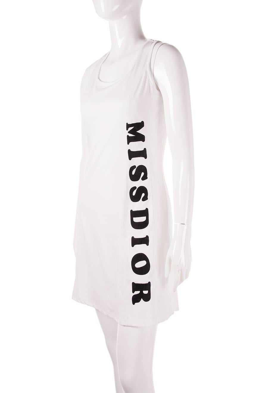 White tank dress in basketball jersey style mesh fabric with the words 