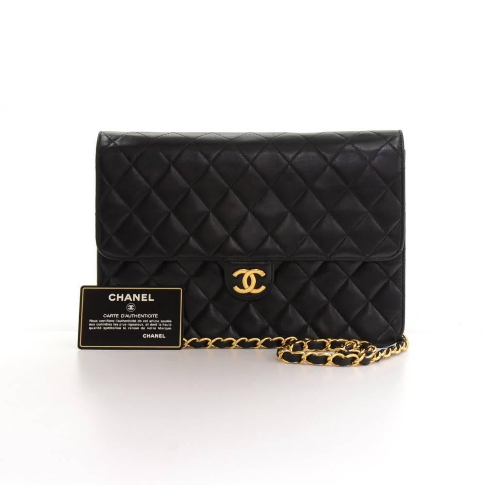 Chanel black quilted leather bag. It has flap with CC logo stud lock on the front. On the inside, it has Chanel red leather lining with one zipper pocket. It can be used as shoulder bag or clutch. 
Made in: France
Serial Number: 6133196
Size: 9.8