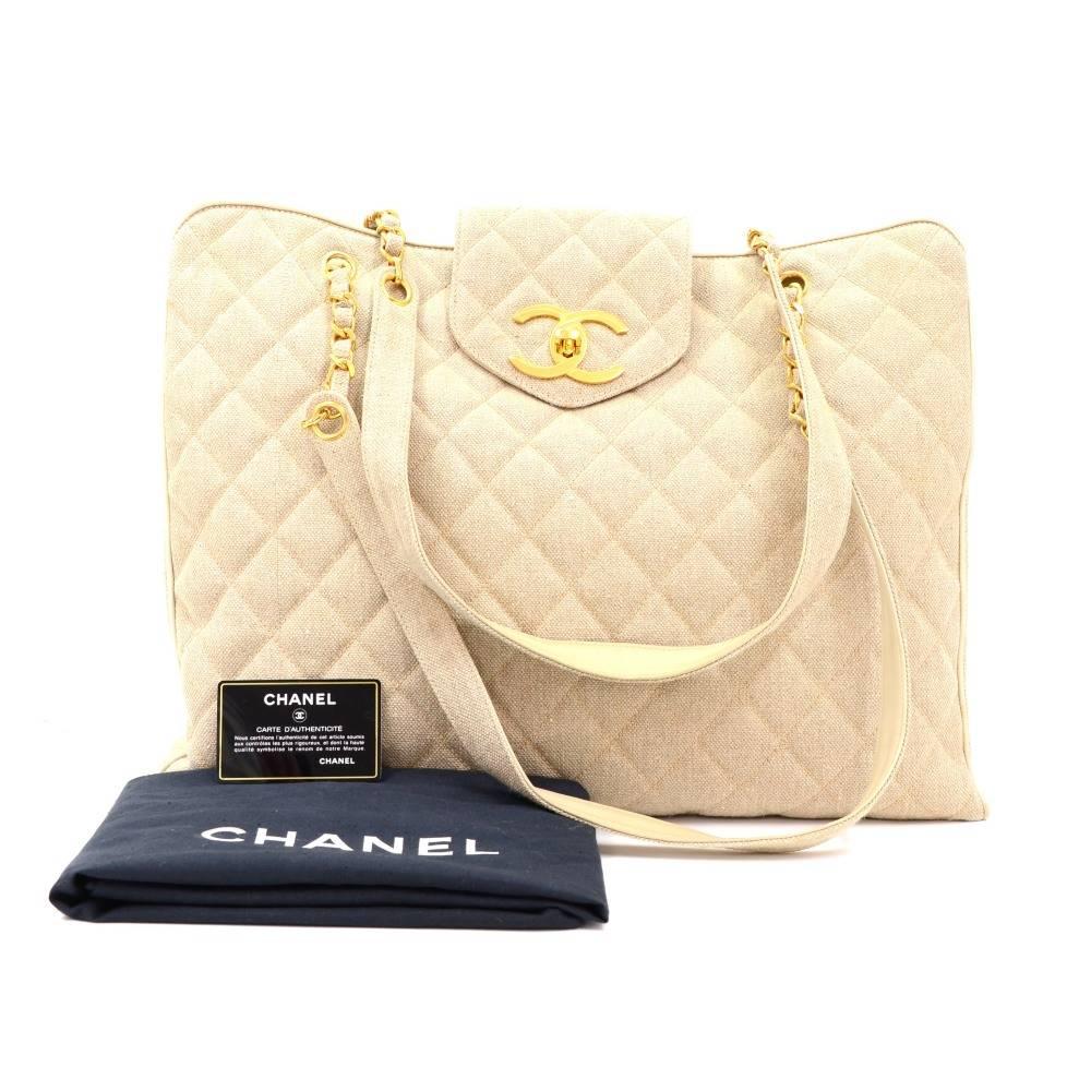 Chanel Weekender Tote in beige quilted canvas outside and botom and inside lambskin leather with silk lining. Top is secured with small flap with large CC twist lock. It is split into 3 compartments and middle is secured with zippers which d has 2