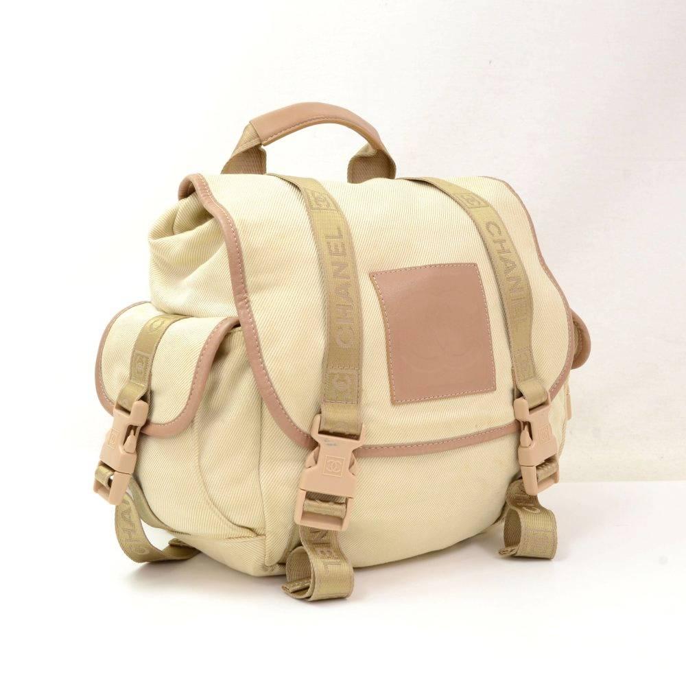 Chanel backpack from the sports line edition in beige canvas. Outside it has 2 small pockets on side. Inside has 1 zipper pocket. Very stylish sports line.

Made in: Italy
Serial Number: 10600337
Size: 10.6 x 9.1 x 4.7 inches or 27 x 23 x 12