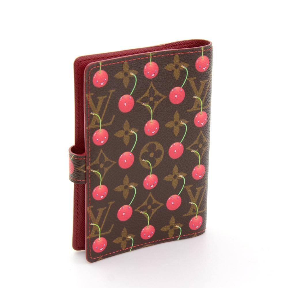 Louis Vuitton cherry monogram Agenda Fonctionnel PM agenda cover. It is 2005 limited collection. It has 3 card slots, 2 open pocket as well 1 pen holder. 

Made in: Spain
Serial Number: CA0045
Size: 3.9 x 5.7 x x inches or 10 x 14.5 x x