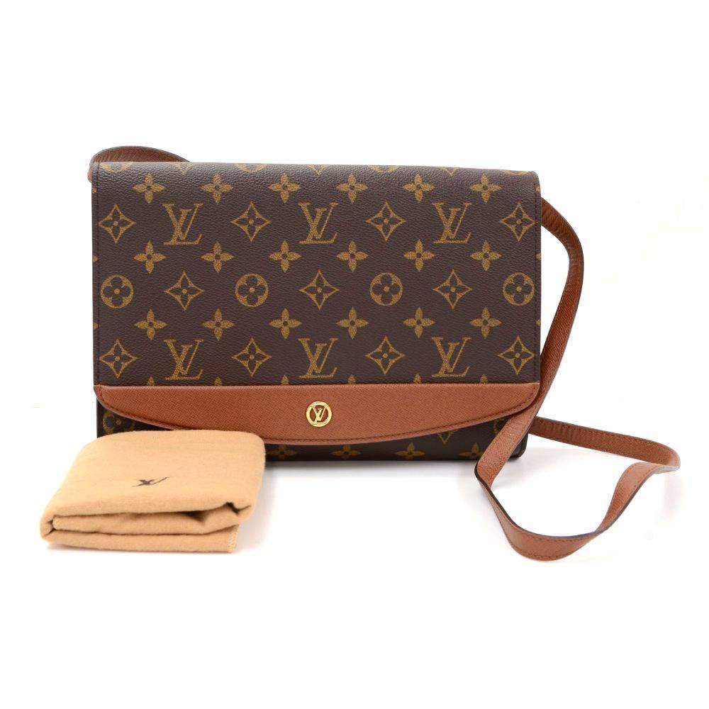 Louis Vuitton Bordeaux bag in Monogram canvas. It features thick leather trim, flap with stud closure and 1 open pocket on back. Inside has 1 zipper pocket. Can be used as shoulder bag or clutch.

Made in: France
Serial Number: MI1908
Size: 10.4