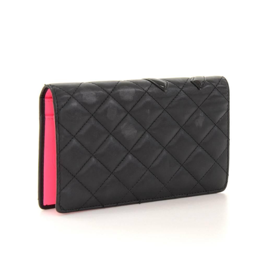 Chanel quilted lambskin leather wallet. Inside is in pink leather lining with 1 coin case with zipper, 2 compartments for note, 2 open pockets and 8 card slots. Very cute and make great companion where you go!

Made in: Italy
Serial Number: