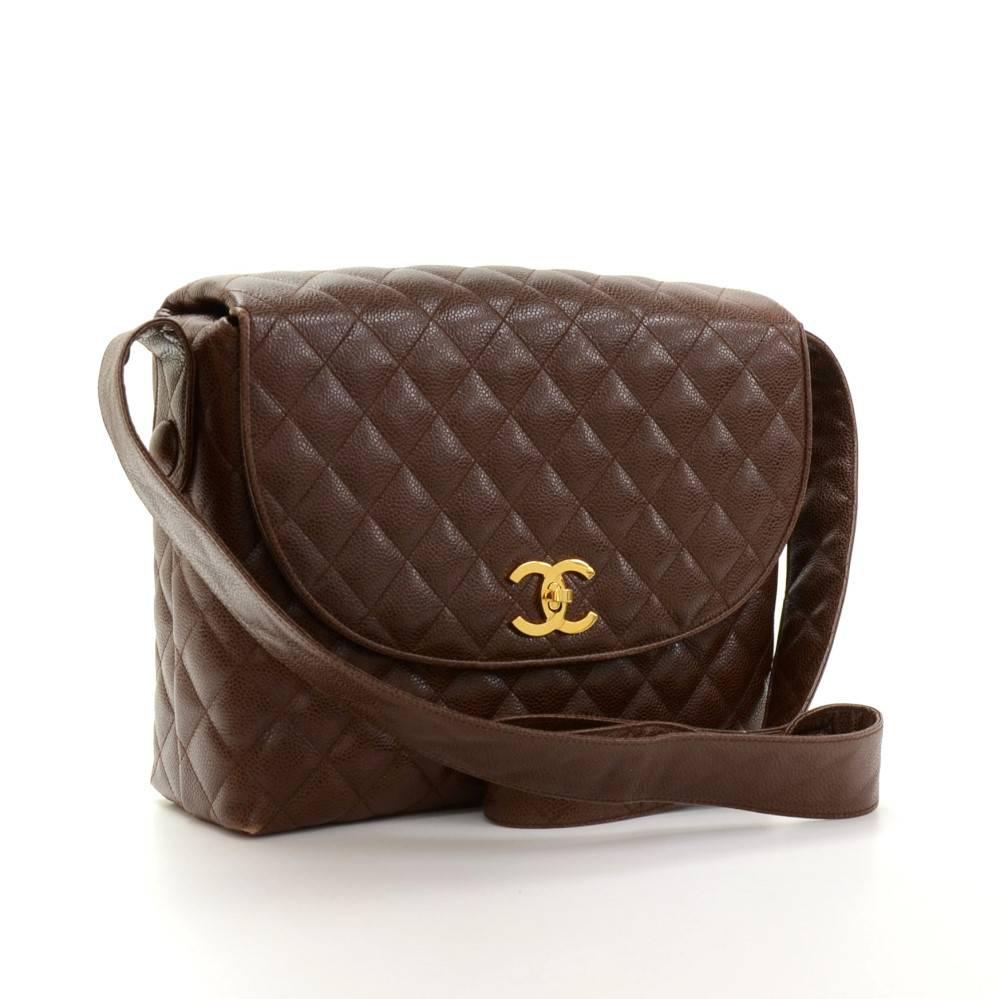 Chanel shoulder bag in dark brown quilted caviar leather. It has one pocket on the back and flap with CC logo twist lock on the front. Inside has two side pockets: 1 open and 1 with zipper. Comfortably carried on shoulder. Ready for any