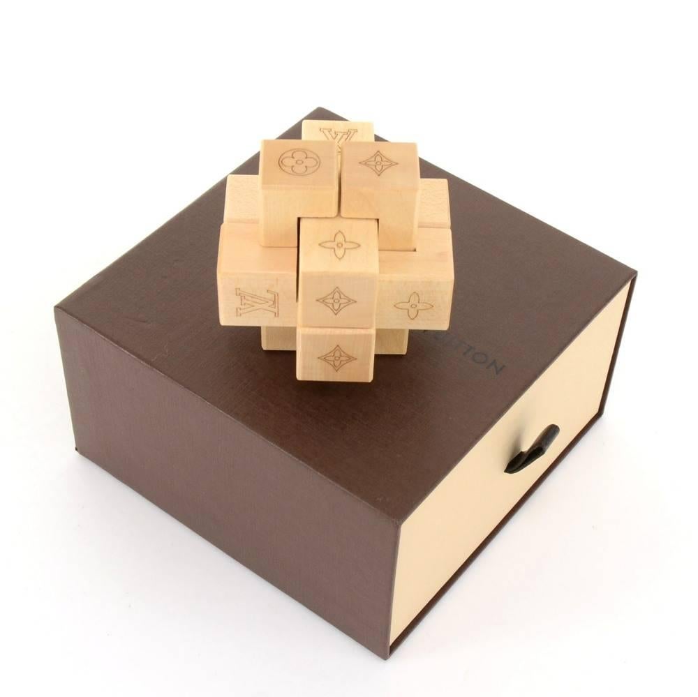 Louis Vuitton Le Pateki wooden puzzle Game. Louis vuitton gives to its VIP customers a gift on the new collection ceremony. Very rare collectors items. 

Made in: France
Dust bag:   Not included  
Box:   Yes included 