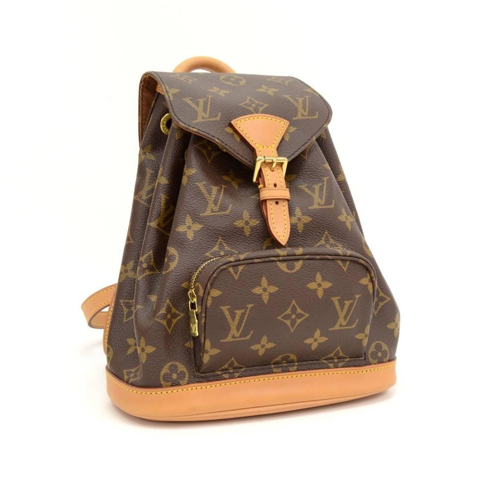 Louis Vuitton Mini Montsouris backpackin monogram canvas. It has 1 zipper pocket on the front. It has leather string closure with flap top for security. Spacious and classy, it would make a great companion wherever you go!

Made in: France
Serial