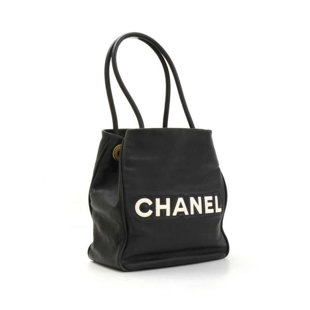 Chanel Camelia Tote in black x white leather. Open access with camelia and CHANEL in white color outside. Inside has light pink cotton lining with 2 zipper pockets. Comfortably carried in hand or on shoulder and offer great capacity.

Made in: