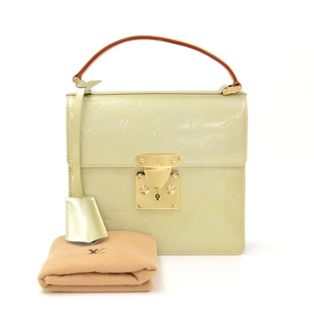 Louis Vuitton Spring Street handbag in vernis leather. Cowhide leather handle. Handheld with flap closure secured with lock which can be locked with key. Inside is open space lined with leather. Lovely bag from discontinued line.

Made in: