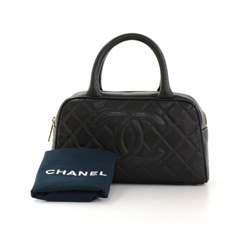 Chanel Mini Boston hand bag in black quilted caviar leather. Outside has 1 open pocket in the back. Main area is secured with zipper. Inside has 1 zipper pocket and textile lining. Great companion where you go.

Made in: France
Serial Number: