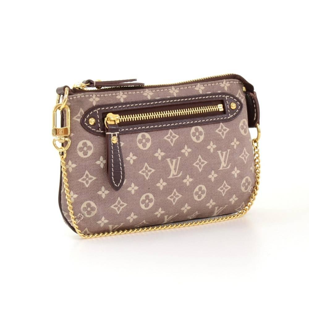 Louis Vuitton Idylle mini accessories pochett in sepia Idylle mini monogram lin canvas. It has zipper closure and 1 zipper pocket outside. Very practical item to have.   

Made in: France
Serial Number: DU3191
Size: 6.7 x 3.9 x 0 inches or 17 x