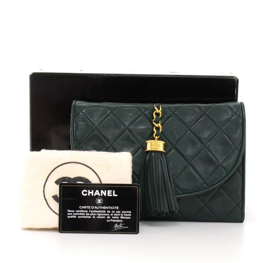 Chanel dark green quilted leather clutch bag. It has flap with stud closure and fringe attached to flap on top. Inside is in black leather lining and 1 zipper pocket. Ready for any occasion. 

Made in: Italy
Serial Number: 0158507
Size: 7.7 x