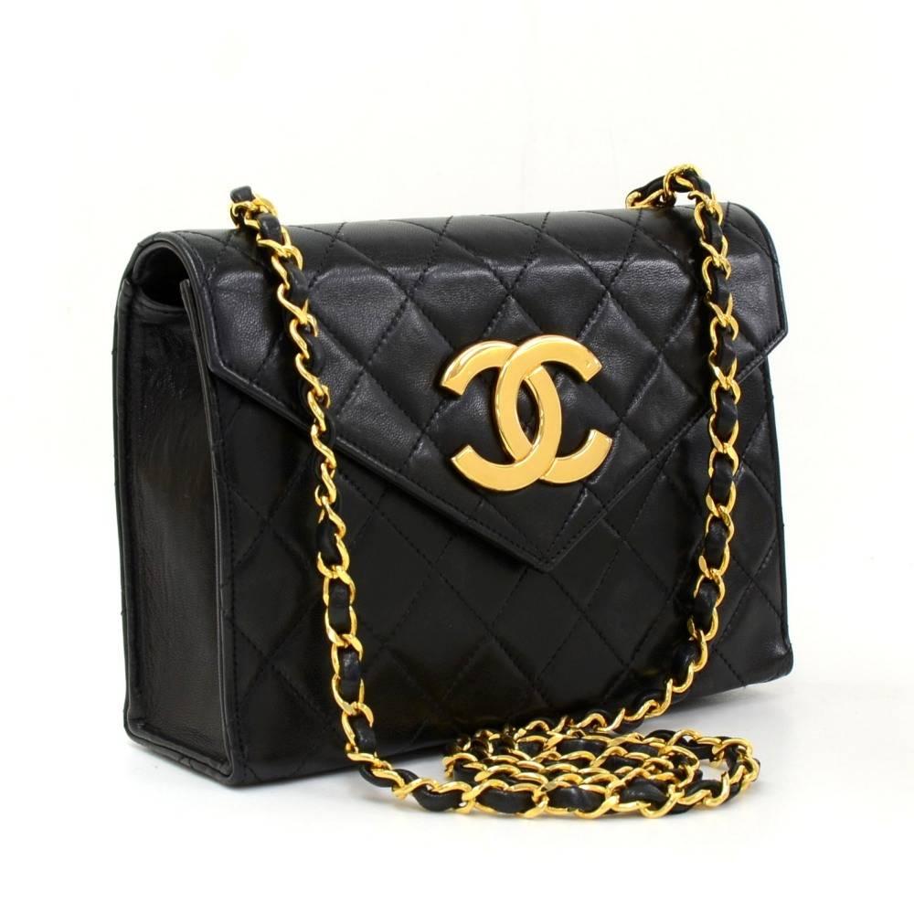 Chanel black quilted leather classic shoulder bag. It has a flap with large famous CC stud closure on the front. Inside has red leather lining and 1 open pocket. Comfortably carry on shoulder or across the body.  

Made in: France
Serial Number: