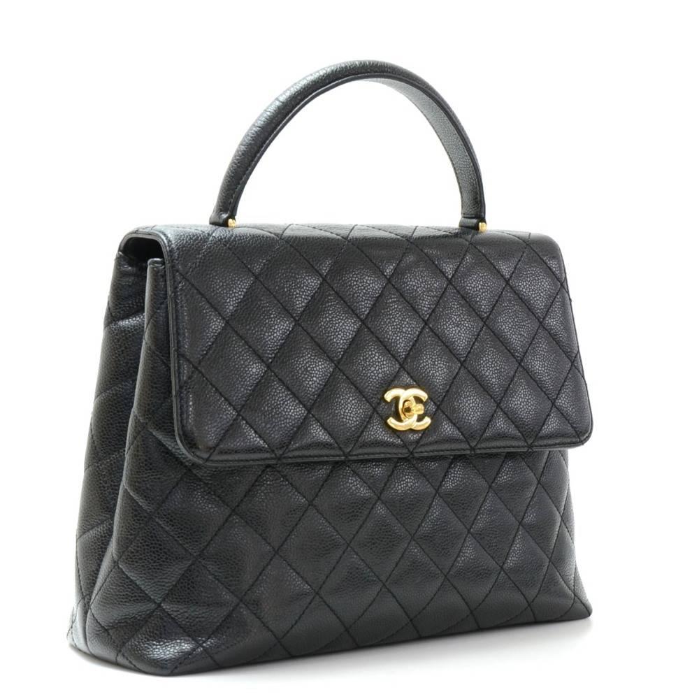 Chanel Kelly style handbag in black caviar leather. It has flap with gold CC twist lock closure on the front. It has 1 open pocket on the back. Inside has black leather lining with 2 pockets; 1 zipper and one open. 

Made in: Italy
Serial Number: