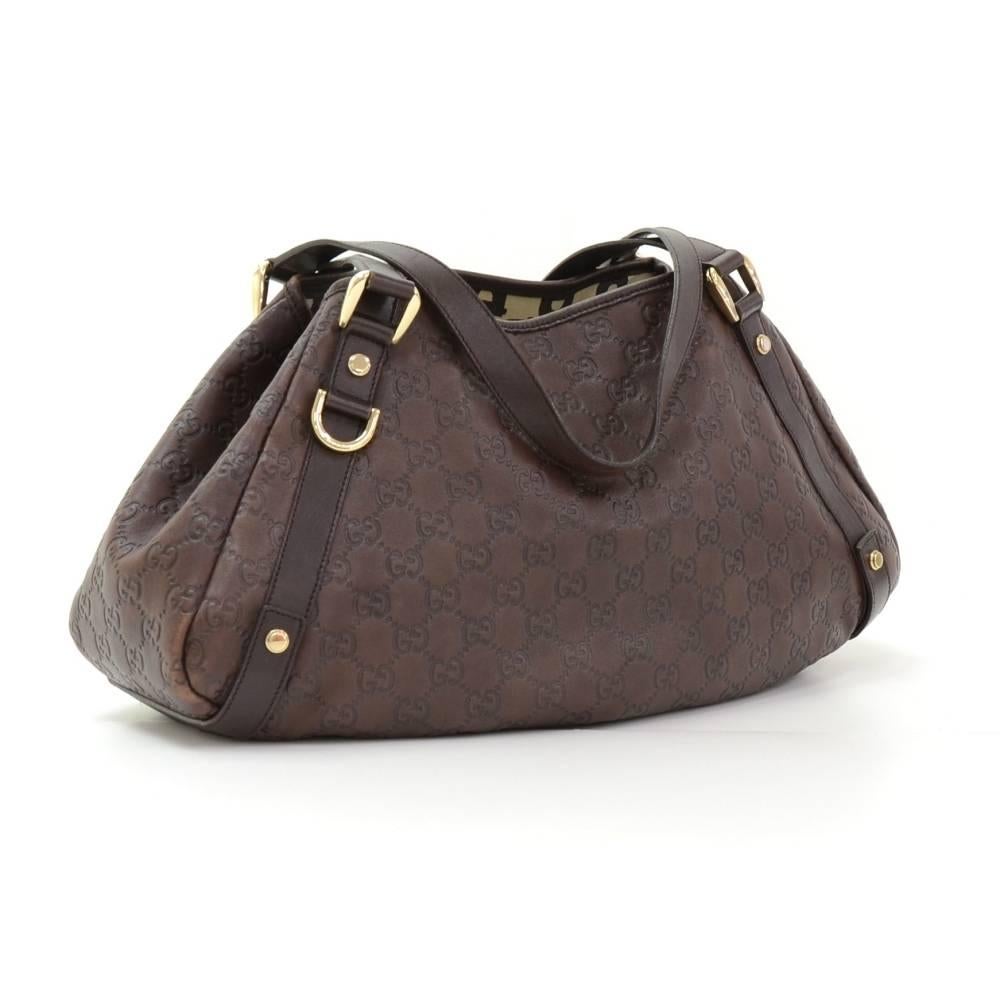 Gucci hand bag in dark brown Guccissima leather. It has stud closure on top with 1 zipper pocket and 1 for mobile. Comfortably carried in hand and offer great capacity.

Made in: Italy
Serial Number: 130736 492493
Size: 14.6 x 9.4 x 3.9 inches