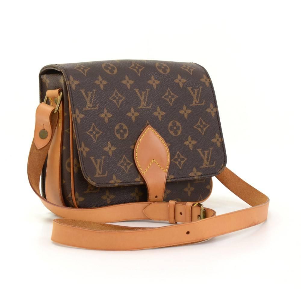 Louis Vuitton Cartouchiere MM in monogram canvas. Flap top secured with belt closure. Inside is brown washable lining. Comfortably carry on shoulder or across body with cowhide leather strap. 

Made in: France
Serial Number: SL 1920
Size: 8.3 x