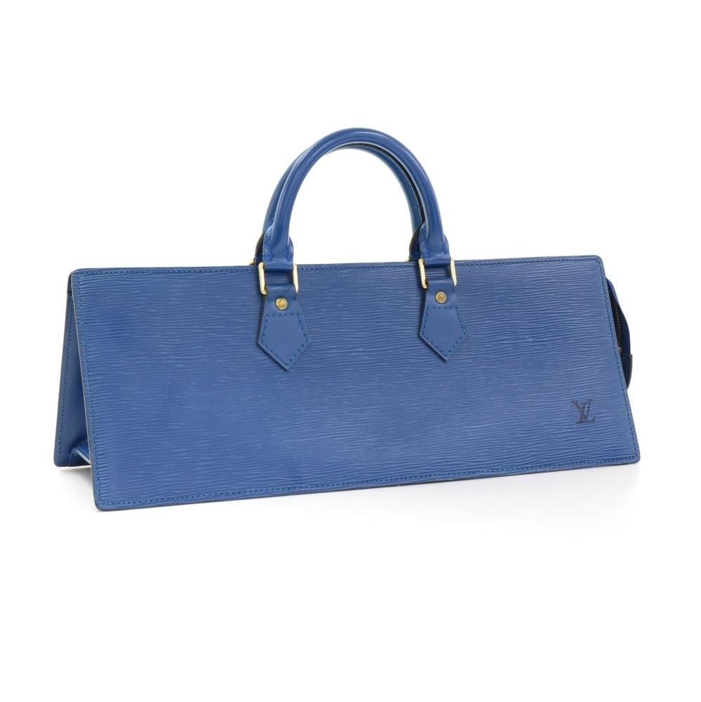 Louis Vuitton Sac Triangle in Epi leather. It is secured with zipper. Inside has black lining with 1 open pocket. Carried in hand. LV embossed on the front. Originally designed to keep your knitting items. 

Made in: France
Serial Number: