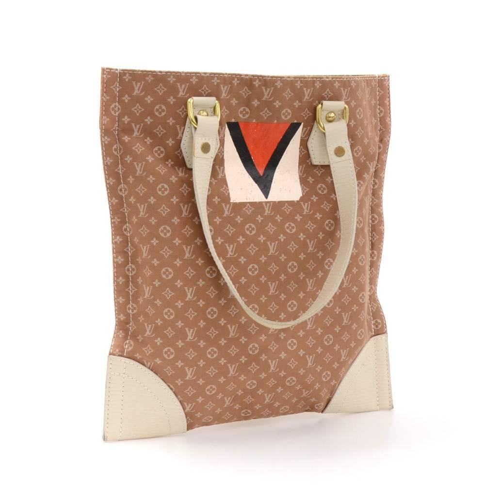 Louis Vuitton Sac Plat Tanger in Monogram mini tote bag. It has white leather on handles and bottom edges. Inside has fabric lining and 1 zipper pocket. Beautiful bag perfect for shopping and daily use.

Made in: France
Serial Number: