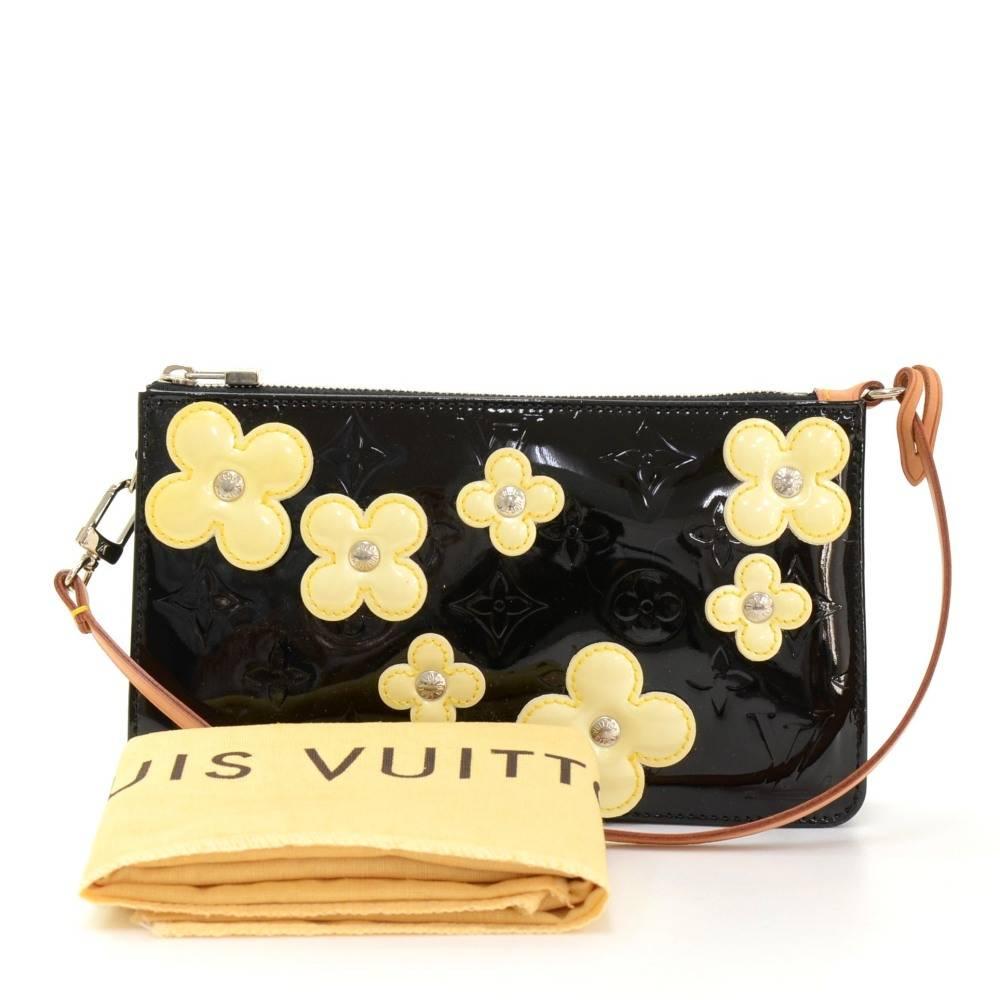 Louis Vuitton Lexington Pochette in vernis leather with flowers. This is a limited edition which was introduced in the year 2001 and it is hard to get.

Made in: Spain
Serial Number: CA 1011
Size: 7.9 x 4.5 x 1.6 inches or 20 x 11.5 x 4