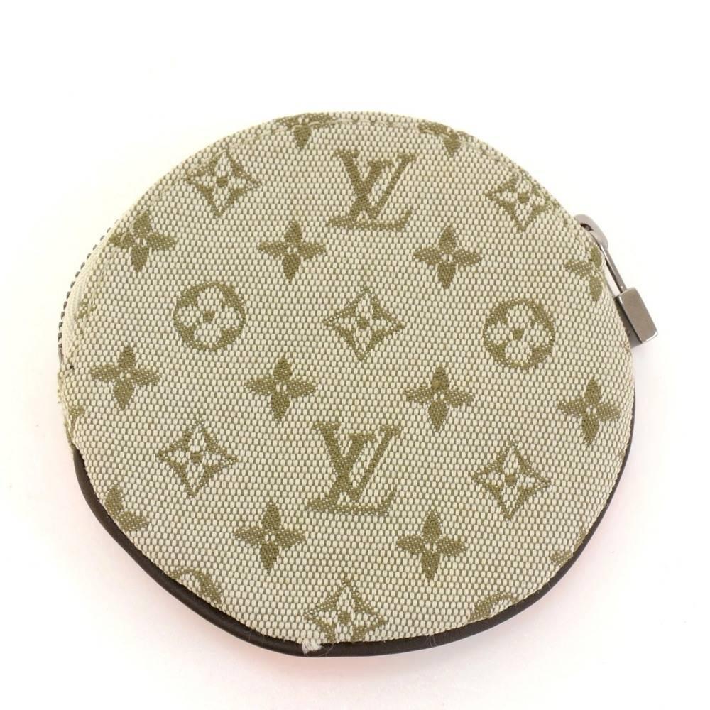 Louis Vuitton Conte De Fees Porte Monnaie Round coin case in mini Monogram canvas. It is from 2002 Limited Edition. It can be used in either way as you please.

Made in: France
Serial Number: MI0042
Size: 3.7 x 3.7 x x inches or 9.5 x 9.4 x x