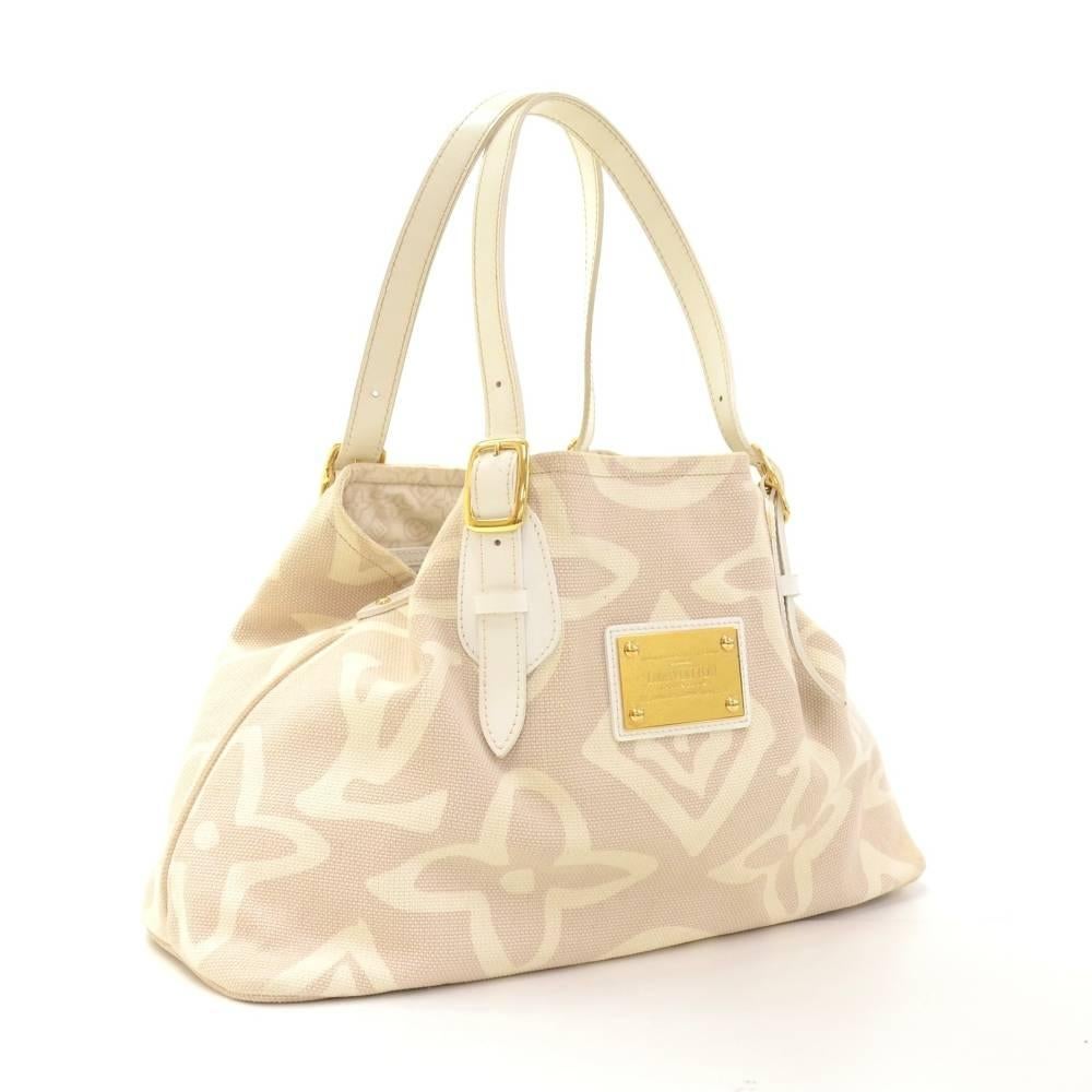 Louis Vuitton Tahitienne Cabas bag in white x beige monogram. Inside is in lovely lining with 1 zipper pocket and 1 for mobile. Extremely rare bag to find.

Made in: France
Serial Number: TH2018
Size: 15.7 x 10.2 x 5.9 inches or 40 x 26 x 15