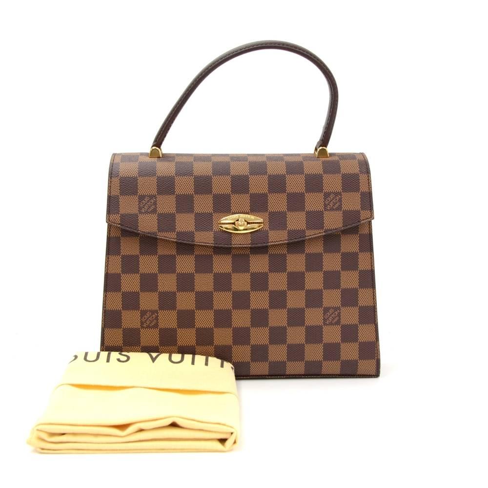 Louis Vuitton Malesherbes hand bag in Ebene damier canvas. Easy access secured with a twist lock on the font. Inside has brown lining with 1 open pocket and 1 zipper pocket. You simply can not go wrong with this item. Very rare to find.

Made in: