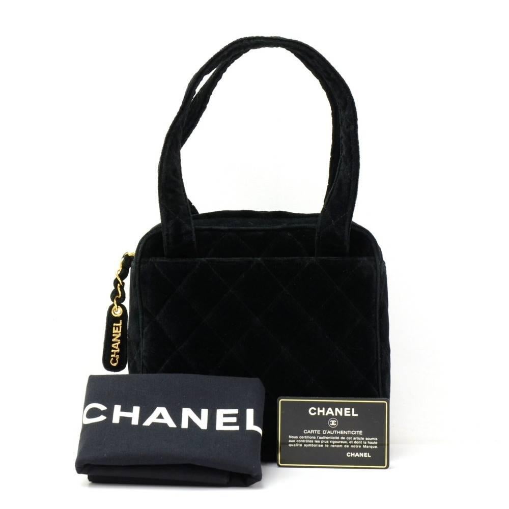 Chanel party bag in Black quilted velvet leather. It has open pocket on each side. Main access has zipper closure. Inside is black leather lining with 1 open and 1 zipper pocket. Wonderful statement bag which would make a great presence wherever you
