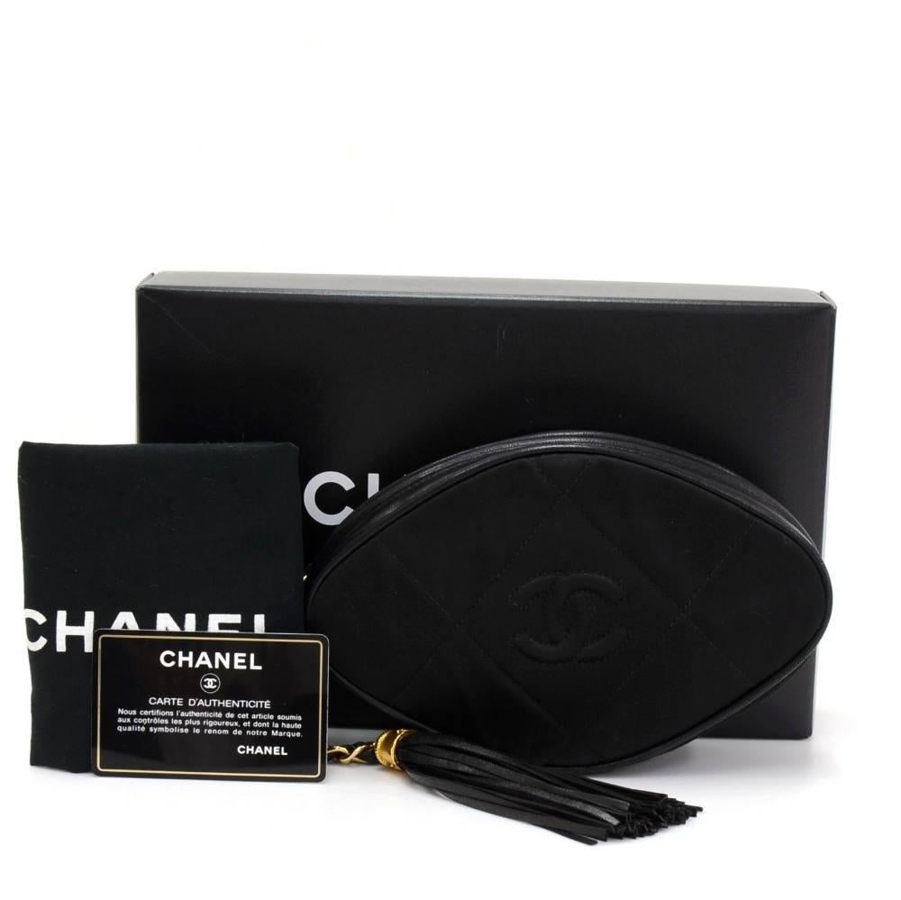 Chanel black quilted nylon /lambskin leather clutch. Simple design and easy access secured with zipper. Inside has red leather lining and 1 zipper pocket. Look so cute!

Made in: Italy
Serial Number: 1100548
Size: 7.5 x 4.7 x 1.8 inches or 19 x