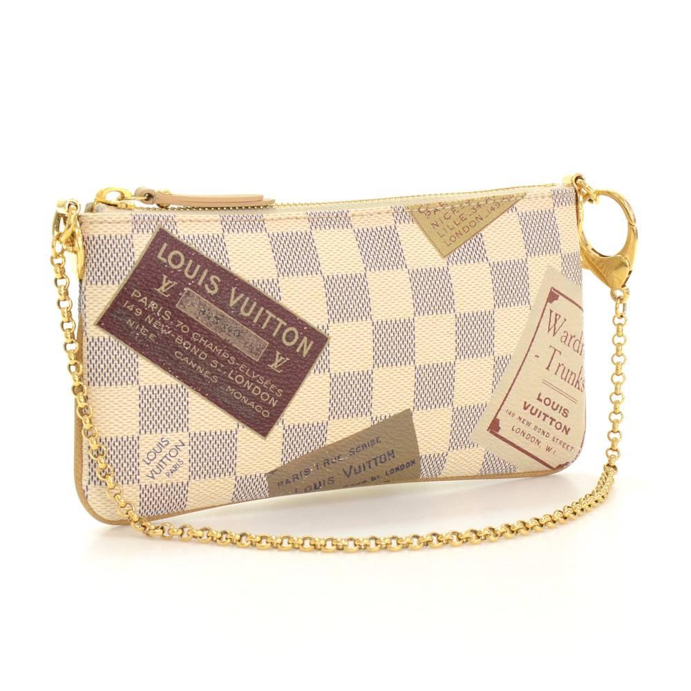 Louis Vuitton Pochette Milla MM pouch in Damier Azur canvas. Perfect for night out and parties. It can be either hand-held or linked to the D-ring found in many Louis Vuitton.

Made in: France
Serial Number: A A 2 0 8 9
Size: 8.1 x 4.3 x 0.6